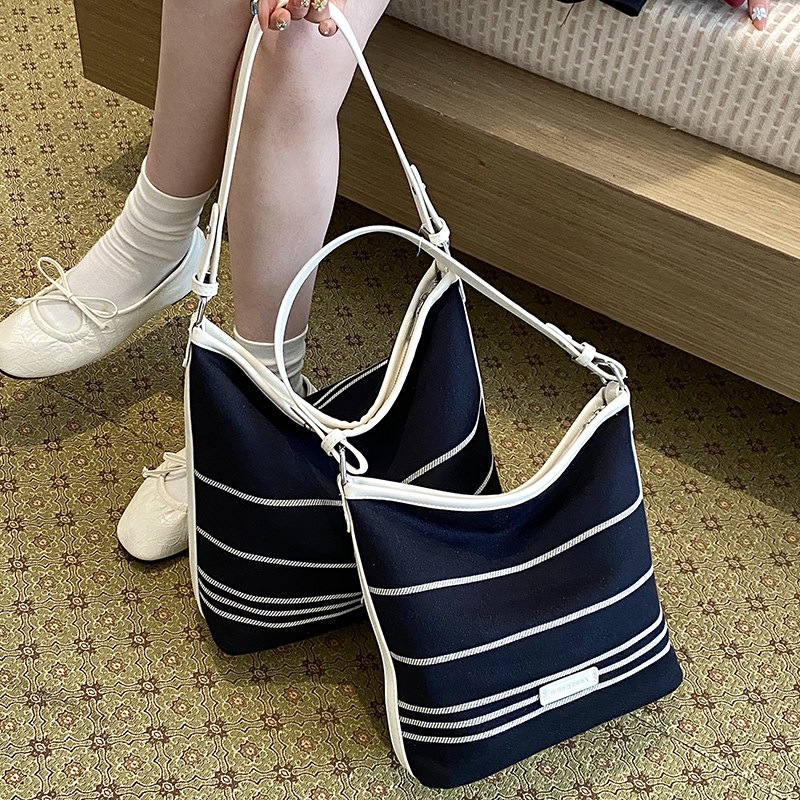 Bolsa Bucket de Lona Listrada  - Luxury Bags Women avaliação e preço